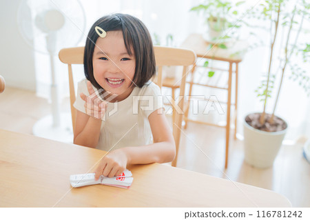 Elementary school student studying math for summer vacation homework 116781242