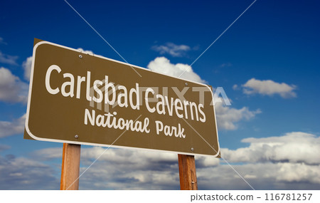 Carlsbad Caverns National Park (New Mexico) Road Sign Against Blue Sky and Clouds. 116781257