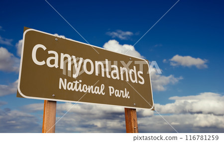 Canyonlands National Park (Utah) Road Sign Against Blue Sky and Clouds. Canyonlands National Park (Utah) Road Sign Against Blue Sky and Clouds. 116781259