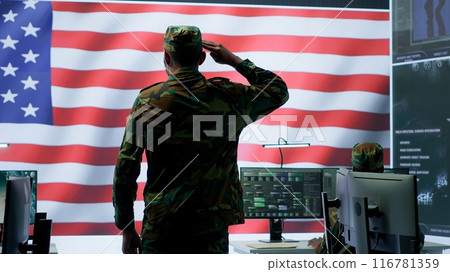 American military personnel supervising cyber warfare activity in high tech office, top secret intelligence on big screen. Governmental experts manage hybrid war, conflict prevention. Camera A. American military personnel supervising cyber warfare activity in high tech office, top secret intelligence on big screen. Governmental experts manage hybrid war, conflict prevention. Camera A. 116781359
