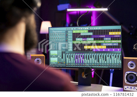 Sound engineer working with audio recordings on daw software interface, editing and adjusting volume levels for new music. Producer adding sound effects on soundtracks, signal processing. Sound engineer working with audio recordings on daw software interface, editing and adjusting volume levels for new music. Producer adding sound effects on soundtracks, signal processing. 116781432