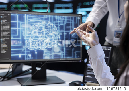 Technicians working in data center with artificial intelligence technology to process massive datasets, close up. IT specialists in server hub facility storing data used for machine learning Technicians working in data center with artificial intelligence technology to process massive datasets, close up. IT specialists in server hub facility storing data used for machine learning 116781543