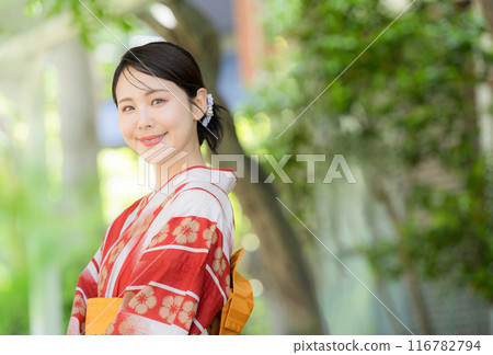 A beautiful Japanese woman in a cute yukata looking up, looking at the camera in the image of a Japanese summer festival or outing A beautiful Japanese woman in a cute yukata looking up, looking at the camera in the image of a Japanese summer festival or outing 116782794