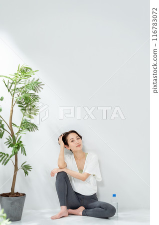 Middle-aged woman yoga sitting Middle-aged woman yoga sitting 116783072