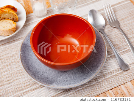 Bowl served on table with cutlery Bowl served on table with cutlery 116783181
