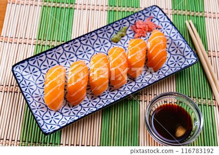 Sushi sake nigiri with salmon served on platter 116783192