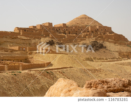 Ruins of deserted village of Ksar Guermessa atop hill in Tataouine Ruins of deserted village of Ksar Guermessa atop hill in Tataouine 116783281