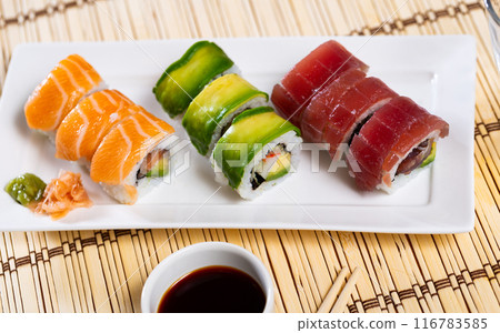 Set of urumaki rolls with salmon, tuna, avocado and crab Set of urumaki rolls with salmon, tuna, avocado and crab 116783585