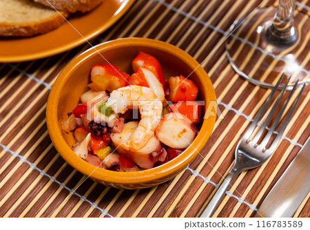 Popular Spanish appetizer, seafood salpicon, is served on plate. 116783589