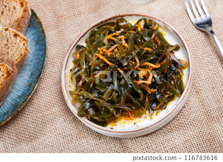 Traditional vegetable appetizer, salad of fresh seaweed. 116783616