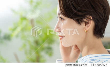 Middle-aged woman living room Middle-aged woman living room 116785973