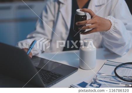 Asian female medical doctor use stethoscope to listen examine check senior elderly patient heart Asian female medical doctor use stethoscope to listen examine check senior elderly patient heart 116786320