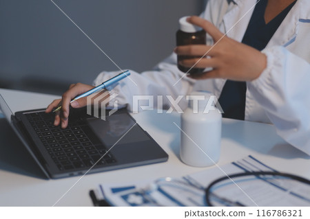 Asian female medical doctor use stethoscope to listen examine check senior elderly patient heart 116786321