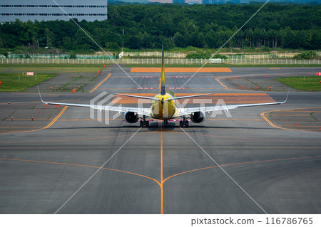 Airplane heading to the runway 116786765