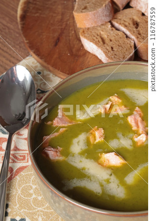 Vegetable cream soup with kale leaves and salmon fish with cheese. Healthy food. Cook for health.  116787559