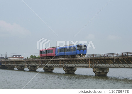 An Oga Line train crossing the Funakoshi Suido iron bridge An Oga Line train crossing the Funakoshi Suido iron bridge 116789778