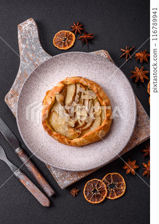Delicious sweet crispy galettes with fruits and cinnamon Delicious sweet crispy galettes with fruits and cinnamon 116789941