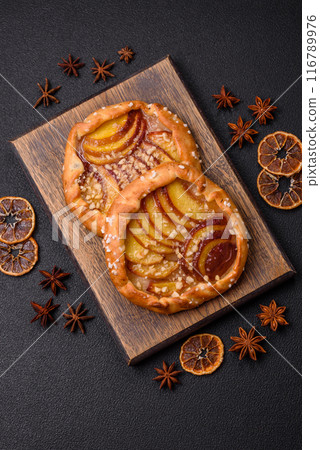 Delicious sweet crispy galettes with fruits and cinnamon 116789976