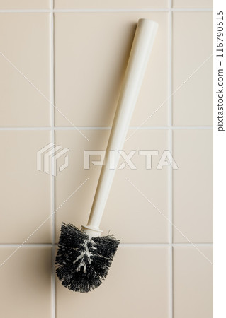 Toilet brush. White wc brush on tile floor. Top view. Toilet brush. White wc brush on tile floor. Top view. 116790515
