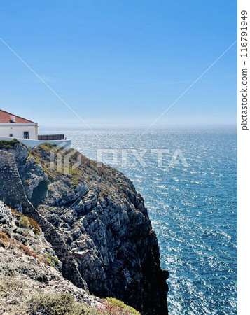 View of strong waves hitting the rock at Sagres, Algarve, Portugal. 116791949