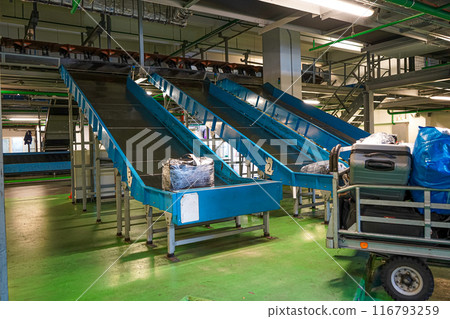 Luggage compartment. Sorting and travel of suitcases to the airport. Luggage compartment automation. Terminal conveyor and trolleys. The path of the suitcase to the plane. Service aero handling 116793259