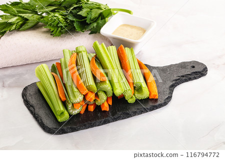 Vegan cuisine - dietary celery and carrot cticks Vegan cuisine - dietary celery and carrot cticks 116794772