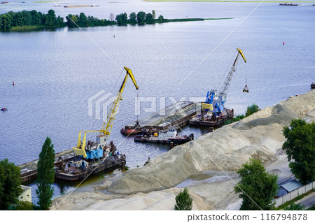River port . Loading sand onto a barge. Drainage of the banks of the Dnieper. River port . Loading sand onto a barge. Drainage of the banks of the Dnieper. 116794878