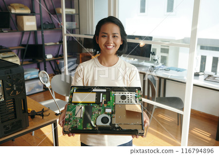 Woman Showing Broken Laptop At Camera 116794896