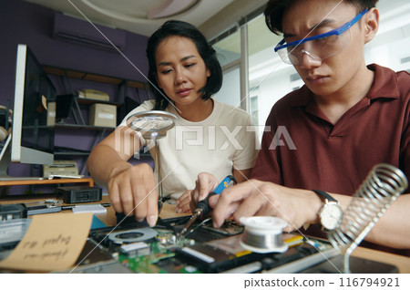 Repair Workers Soldering Board Together 116794921
