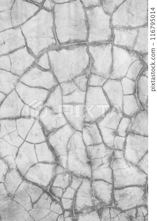 The image is a close up of a wall with cracks and holes in it 116795014