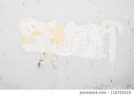 A wall with white paint and yellow paint splatters A wall with white paint and yellow paint splatters 116795016