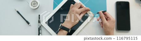Repairman Repairing Broken Screen Of Digital Tablet Repairman Repairing Broken Screen Of Digital Tablet 116795115