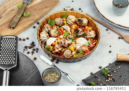 Escargot snail filled with garlic Escargot snail filled with garlic 116795451