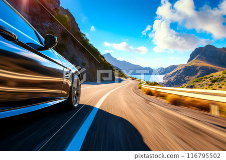 Car traveling with a mountain road at summer day. 116795502