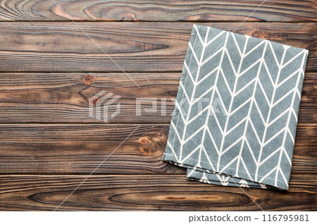 top view with blue kitchen napkin isolated on table background. Folded cloth for mockup with copy space, Flat lay. Minimal style 116795981