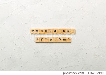 menopausal symptoms word written on wood block. menopausal symptoms text on cement table for your desing, concept menopausal symptoms word written on wood block. menopausal symptoms text on cement table for your desing, concept 116795990