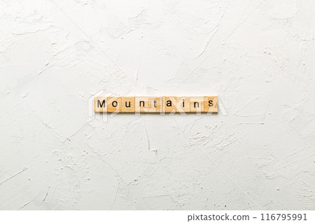 mountains word written on wood block. mountains text on cement table for your desing, concept mountains word written on wood block. mountains text on cement table for your desing, concept 116795991