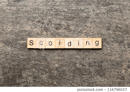 scolding word written on wood block. scolding text on table, concept scolding word written on wood block. scolding text on table, concept 116796037