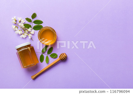 honey jar with acacia flowers and leaves. fresh honey top view flat lay 116796094