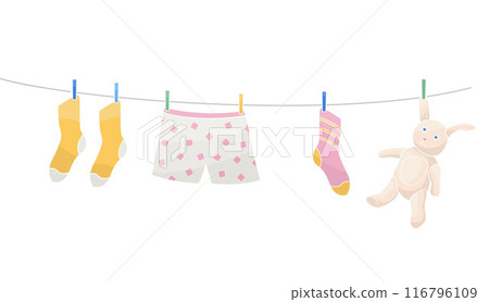 clothes and toy are dried on a line after washing clothes and toy are dried on a line after washing 116796109