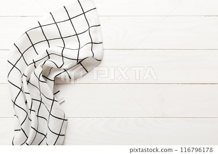 top view with white empty kitchen napkin isolated on table background. Folded cloth for mockup with copy space, Flat lay. Minimal style top view with white empty kitchen napkin isolated on table background. Folded cloth for mockup with copy space, Flat lay. Minimal style 116796178