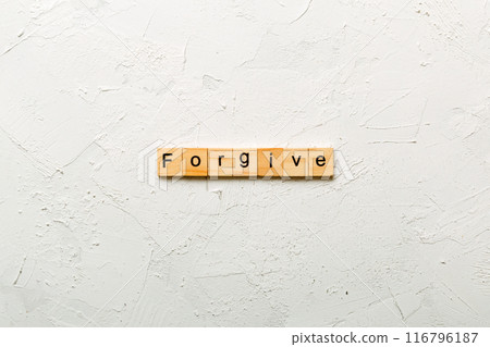 Forgive word written on wood block. Forgive text on cement table for your desing, Top view concept 116796187