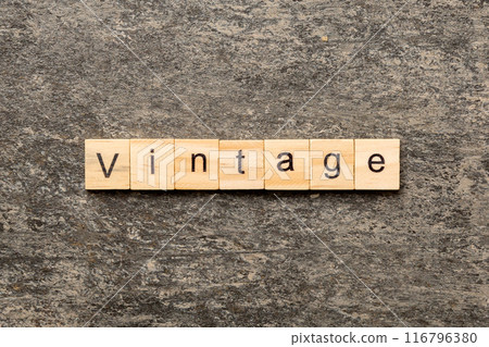 vintage word written on wood block. vintage text on cement table for your desing, concept vintage word written on wood block. vintage text on cement table for your desing, concept 116796380