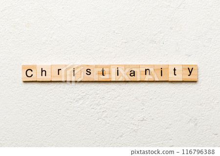 christianity word written on wood block. christianity text on table, concept christianity word written on wood block. christianity text on table, concept 116796388