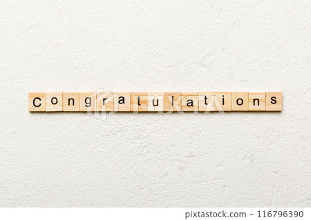 congratulations word written on wood block. congratulations text on cement table for your desing, concept 116796390