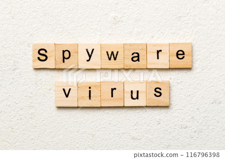 Spyware virus word written on wood block. Spyware virus text on cement table for your desing, concept 116796398