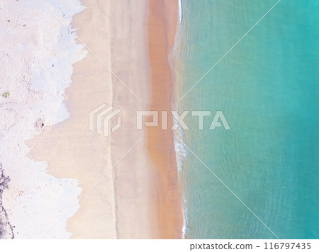 Aerial top view nature background of waves crashing in the ocean sea water, Drone view of sea waves in bird eye view photo,Beach sea background Aerial top view nature background of waves crashing in the ocean sea water, Drone view of sea waves in bird eye view photo,Beach sea background 116797435
