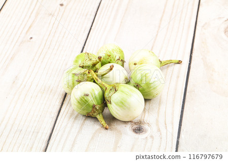 Small organic young green round eggplant 116797679