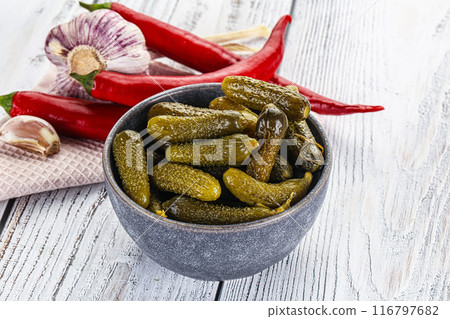 Marinated small cucumbers in the bowl Marinated small cucumbers in the bowl 116797682