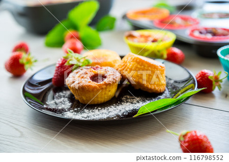 Sweet curd muffins with strawberry filling 116798552